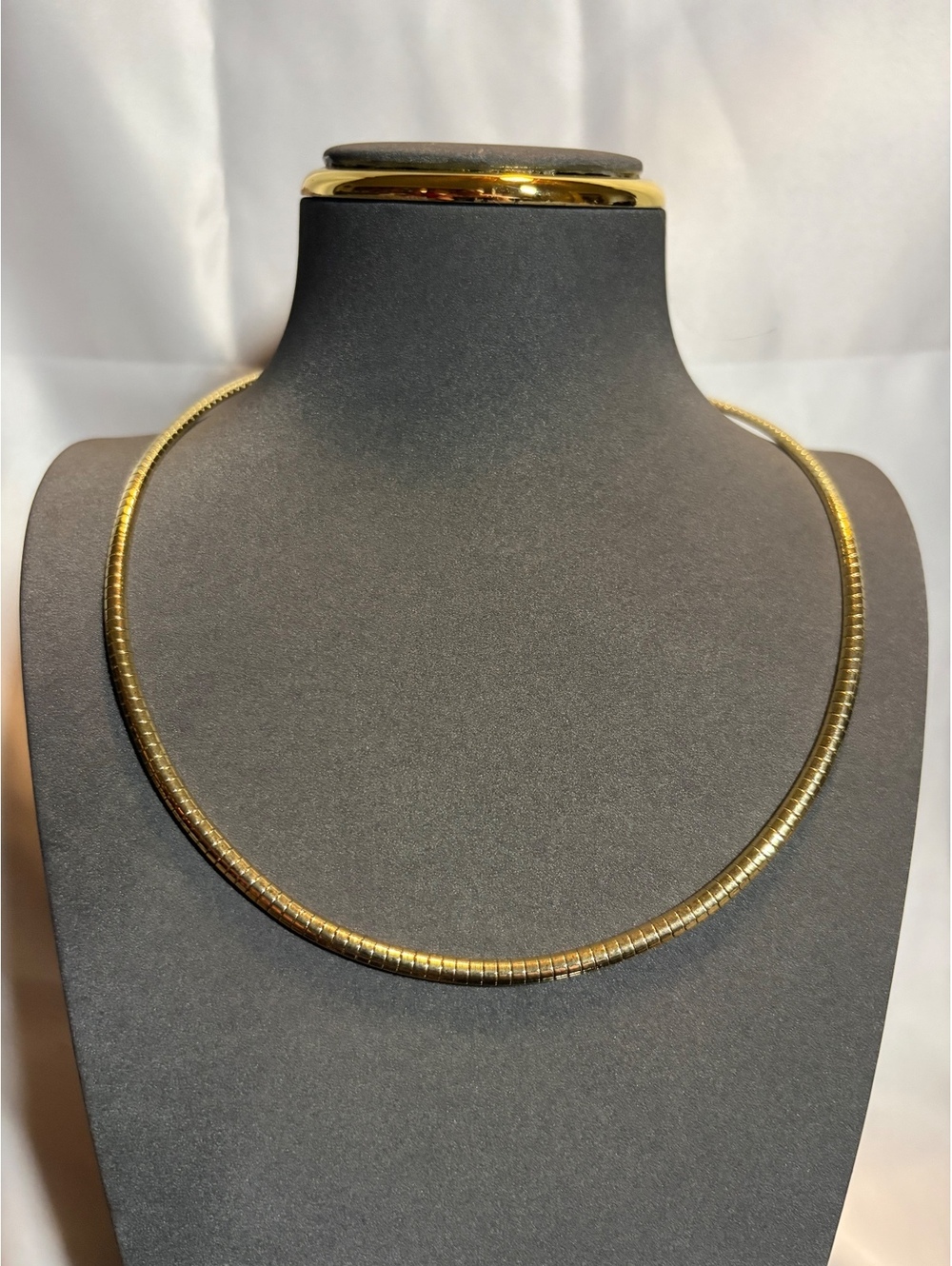 Gold tone herringbone chain necklace